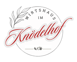 Das Logo vom Wirtshaus Knödelhof mit rotem Schriftzug auf weißen Kreis ergänzt mit einem Zweig mit Blättern.